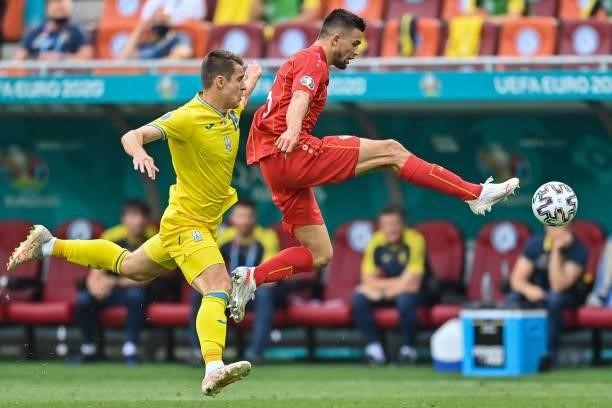 North Macedonia's defender Visar Musliu fights for the ball with Ukraine's forward Artem Besedin during the UEFA EURO 2020 Group C football match...