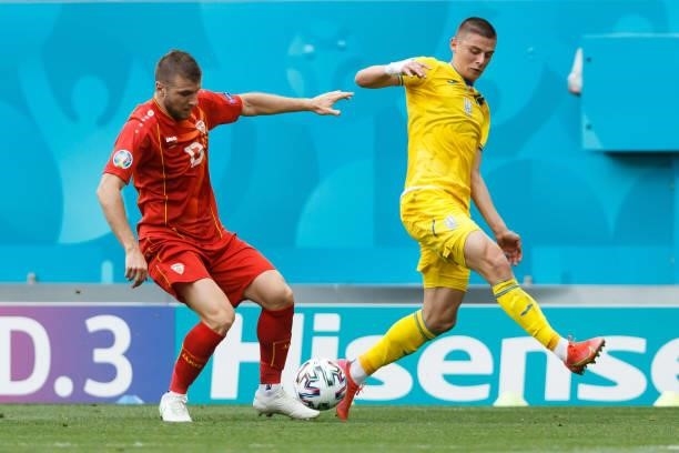Stefan Ristovski of North Macedonia and Yevhen Makarenko of Ukraine battle for the ball during the UEFA Euro 2020 Championship Group C match between...