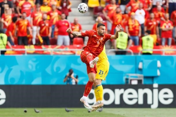 Ivan Triokovski of North Macedonia and Oleksandr Karavaev of Ukraine battle for the ball during the UEFA Euro 2020 Championship Group C match between...