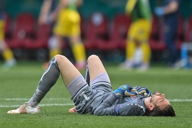 North Macedonia's goalkeeper Stole Dimitrievski reacts after losing the UEFA EURO 2020 Group C football match between Ukraine and North Macedonia at...