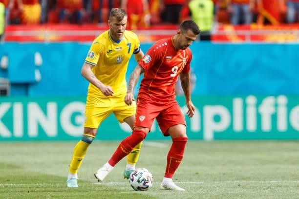 Andriy Yarmolenko of Ukraine and Aleksandar Trajkovski of North Macedonia battle for the ball during the UEFA Euro 2020 Championship Group C match...