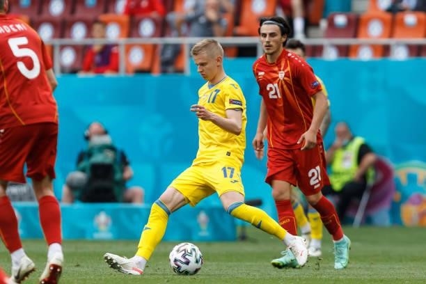 Oleksandr Zinchenko of Ukraine and Eljif Elmas of North Macedonia battle for the ball during the UEFA Euro 2020 Championship Group C match between...