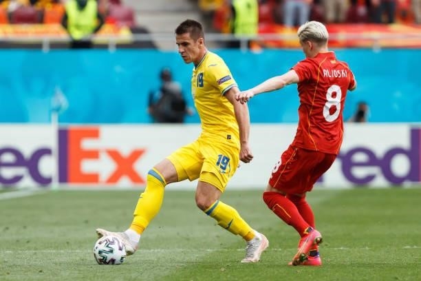 Artem Besedin of Ukraine and Egzjan Alioski of North Macedonia battle for the ball during the UEFA Euro 2020 Championship Group C match between...