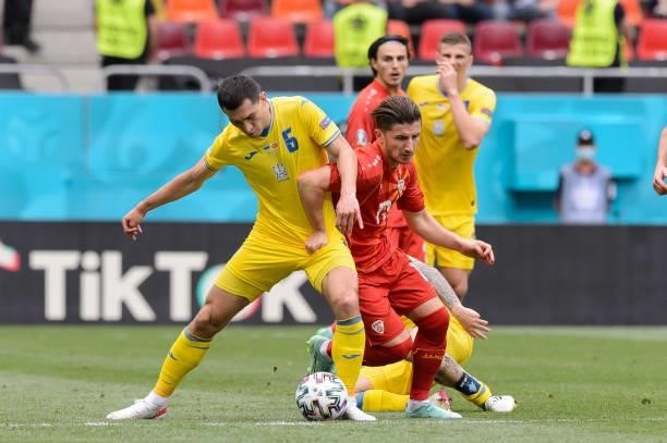 Taras Stepanenko of Ukraine and Enis Bardi of North Macedonia battle for the ball during the UEFA Euro 2020 Championship Group C match between...