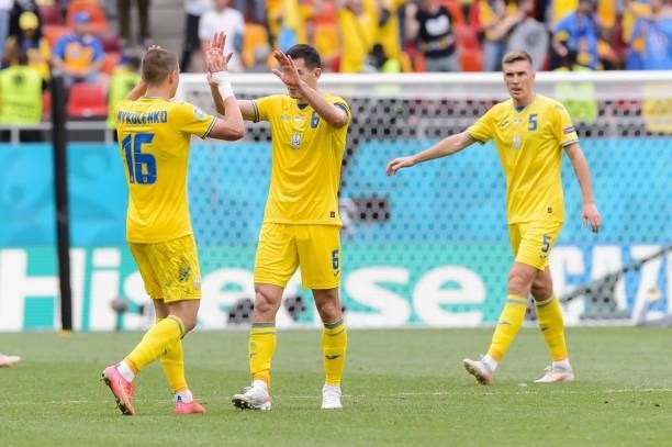 Vitaliy Mykolenko of Ukraine and Taras Stepanenko of Ukraine gestures after the UEFA Euro 2020 Championship Group C match between Ukraine and North...