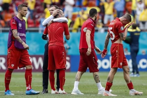 North Macedonia's players react after losing the UEFA EURO 2020 Group C football match between Ukraine and North Macedonia at the National Arena in...