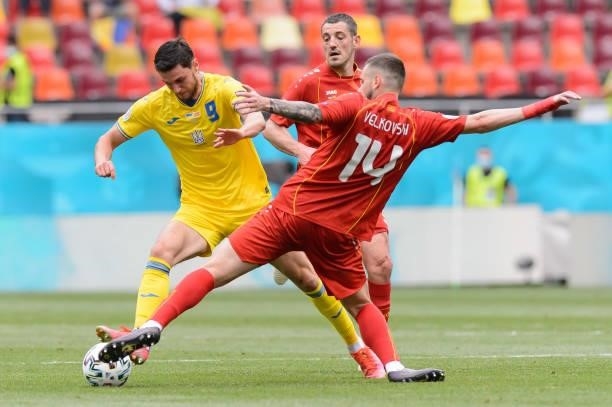 Roman Yaremchuk of Ukraine and Darko Velkovski of North Macedonia battle for the ball during the UEFA Euro 2020 Championship Group C match between...