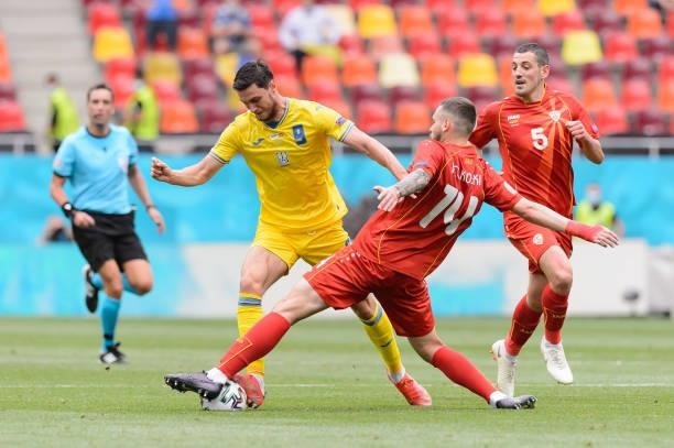 Roman Yaremchuk of Ukraine and Darko Velkovski of North Macedonia battle for the ball during the UEFA Euro 2020 Championship Group C match between...