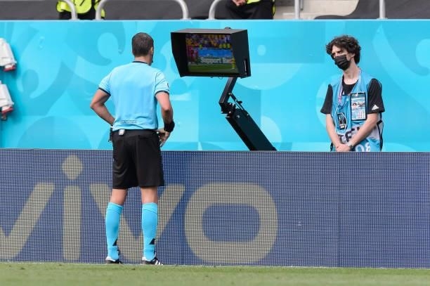 Referee Fernando Andres Rapallini looks at the VAR during the UEFA Euro 2020 Championship Group C match between Ukraine and North Macedonia at...