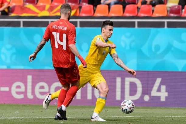 Mykola Shaparenko of Ukraine and Darko Velkovski of North Macedonia battle for the ball during the UEFA Euro 2020 Championship Group C match between...