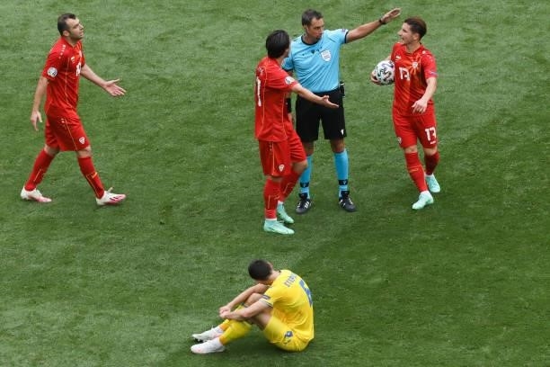 The referee whistles for a foul during the UEFA Euro 2020 Championship Group C match between Ukraine and North Macedonia at National Arena on June...