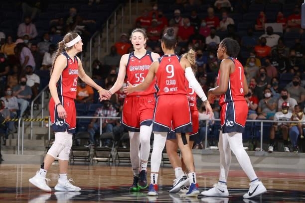 Theresa Plaisance of the Washington Mystics high fives her teammates during the game against the Atlanta Dream on June 17, 2021 at Entertainment &...