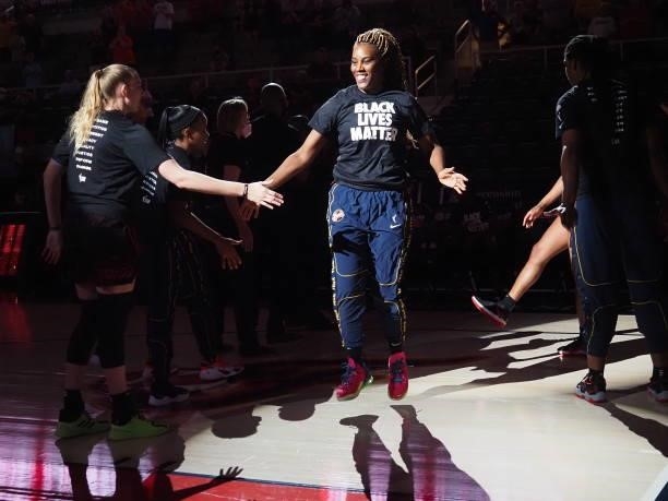 Jantel Lavender of the Indiana Fever high fives before the game against the Seattle Storm on June 17, 2021 at Indiana Farmers Coliseum Fieldhouse in...
