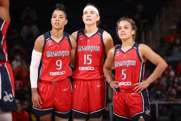Natasha Cloud, Sydney Wiese and Leilani Mitchell of the Washington Mystics look on during the game against the Atlanta Dream on June 17, 2021 at...