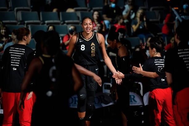 Liz Cambage of the Las Vegas Aces high fives before the game against the New York Liberty on June 17, 2021 at Michelob ULTRA Arena in Las Vegas,...