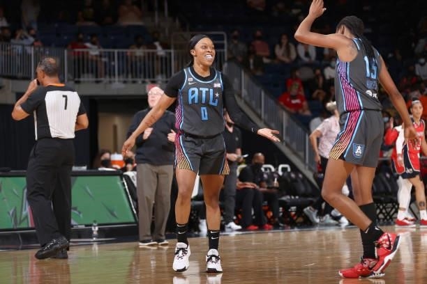 Odyssey Sims and Tiffany Hayes of the Atlanta Dream high five during the game against the Washington Mystics on June 17, 2021 at Entertainment &...