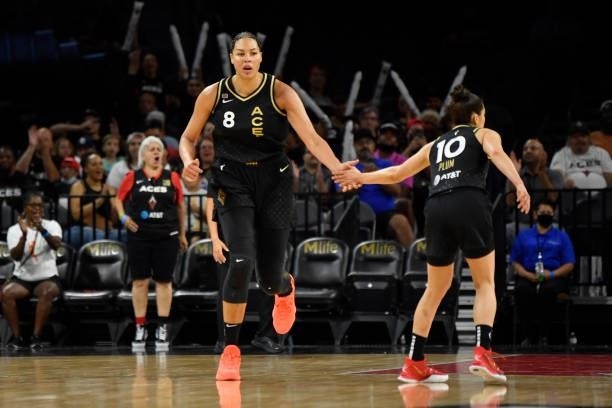 Liz Cambage of the Las Vegas Aces high fives Kelsey Plum of the Las Vegas Aces during the game against the New York Liberty on June 17, 2021 at...