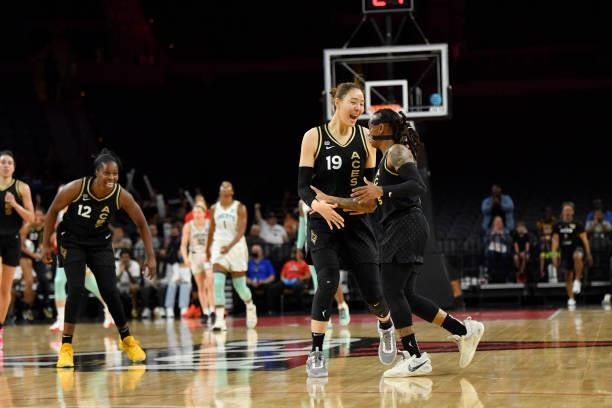 JiSu Park of the Las Vegas Aces high fives Riquna Williams of the Las Vegas Aces during the game against the New York Liberty on June 17, 2021 at...
