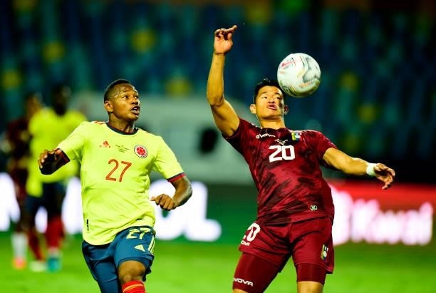 Ronald Hernandez of Venezuela competes for the ball with Jaminton Campaz of Colombia during the match between Colombia and Venezuela as part of...