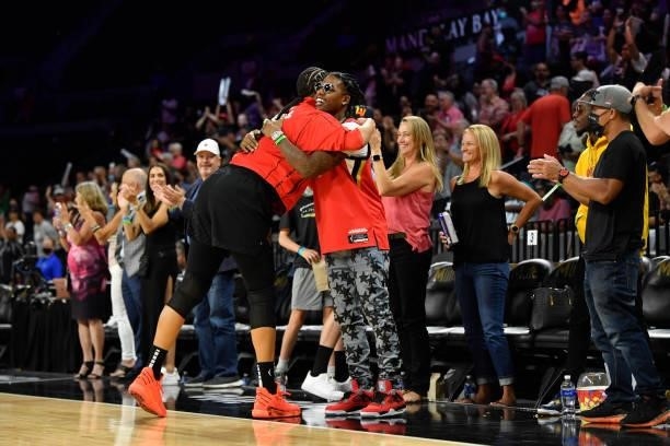 Liz Cambage of the Las Vegas Aces hugs Music artist, CJ SO COOL after the game against the New York Liberty on June 17, 2021 at Michelob ULTRA Arena...