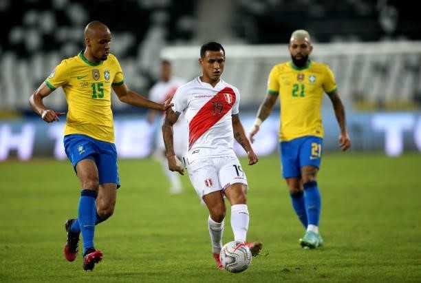 Yoshimar Yotun of Peru competes for the ball with Fabinho of Brazil during the match between Brazil and Peru as part of the Conmebol Copa America...