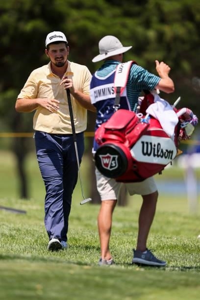 Quade Cummins and his caddie walk to the 9th green during the first round of the Wichita Open Benefitting KU Wichita Pediatrics at Crestview Country...