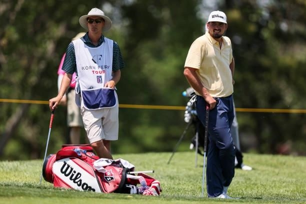 Quade Cummins and his caddie look on from the 9th green during the first round of the Wichita Open Benefitting KU Wichita Pediatrics at Crestview...