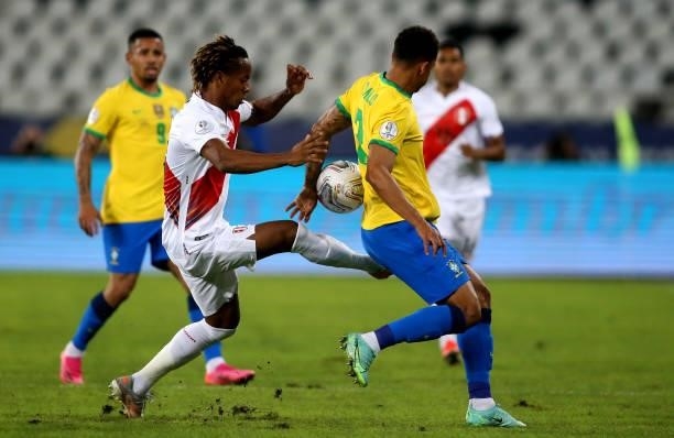 Andre Carrillo of Peru competes for the ball with Danilo of Brazil during the match between Brazil and Peru as part of the Conmebol Copa America...