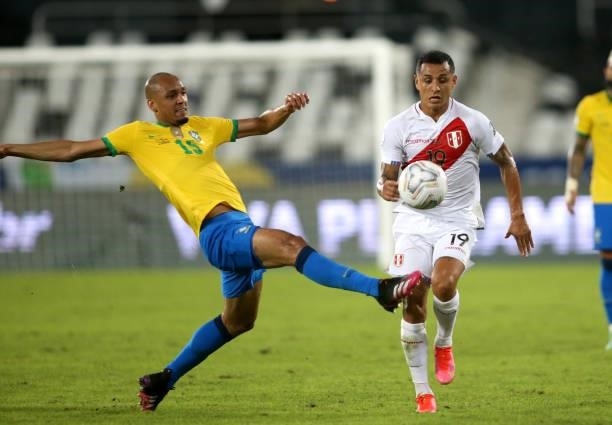 Yoshimar Yotun of Peru competes for the ball with Fabinho of Brazil during the match between Brazil and Peru as part of the Conmebol Copa America...