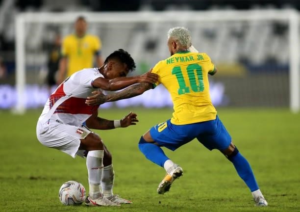 Neymar of Brazil competes for the ball with Renato Tapia of Peru during the match between Brazil and Peru as part of the Conmebol Copa America Brazil...