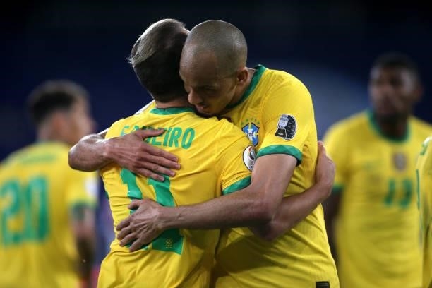 Everton Ribeiro of Brazil celebrates after scores his goal with his team mates Fabinho during the match between Brazil and Peru as part of Conmebol...
