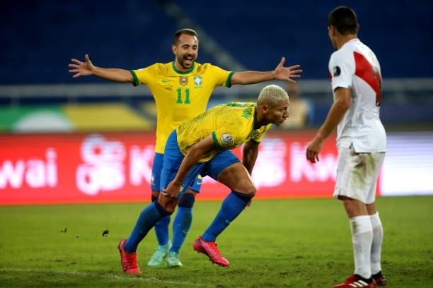 Richarlison of Brazil celebrates after scores his goal with his team mates Everton Ribeiro during the match between Brazil and Peru as part of...