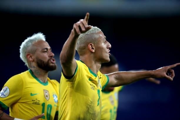 Richarlison of Brazil celebrates after scores his goal with his team mate Neymar during the match between Brazil and Peru as part of Conmebol Copa...