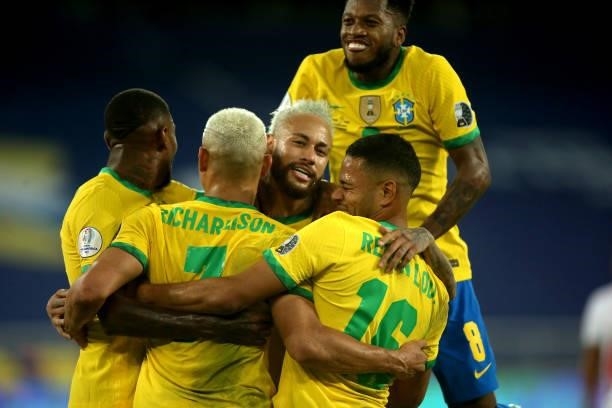 Richarlison of Brazil celebrates after scores his goal with his team mates Neymar, Emerson, Renan Lodi and Fred during the match between Brazil and...