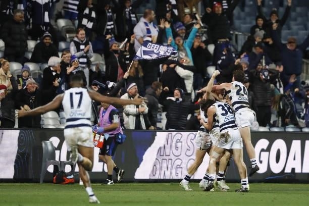 Gary Rohan of the Cats celebrates with teammates after kicking a goal to win the match after the siren during the 2021 AFL Round 14 match between the...