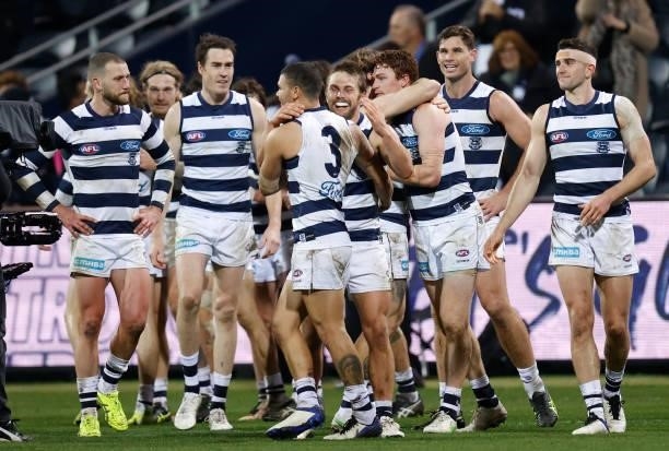 Cats players celebrate after Gary Rohan of the Cats kicked a goal after the siren to win the match during the 2021 AFL Round 14 match between the...