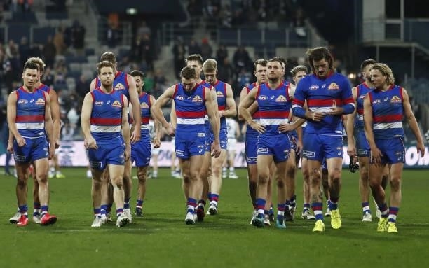 Western Bulldogs players leave the field after a loss during the 2021 AFL Round 14 match between the Geelong Cats and the Western Bulldogs at GMHBA...