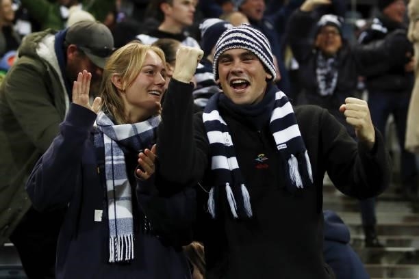 Geelong Cats fans celebrate during the 2021 AFL Round 14 match between the Geelong Cats and the Western Bulldogs at GMHBA Stadium on June 18, 2021 in...