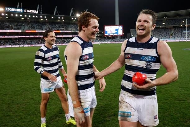 Luke Dahlhaus, Gary Rohan and Patrick Dangerfield of the Cats celebrate during the 2021 AFL Round 14 match between the Geelong Cats and the Western...