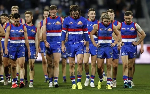 Josh Bruce of the Bulldogs and Cody Weightman of the Bulldogs looks dejected after a loss during the 2021 AFL Round 14 match between the Geelong Cats...