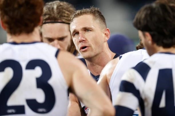 Joel Selwood of the Cats addresses his players during the 2021 AFL Round 14 match between the Geelong Cats and the Western Bulldogs at GMHBA Stadium...