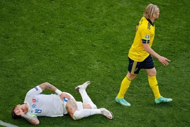 Slovakia's midfielder Juraj Kucka reacts after a challenge from Sweden's midfielder Sebastian Larsson during the UEFA EURO 2020 Group E football...
