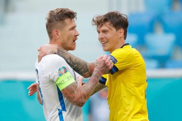 Sweden's defender Victor Lindelof talks to Slovakia's midfielder Juraj Kucka during the UEFA EURO 2020 Group E football match between Sweden and...