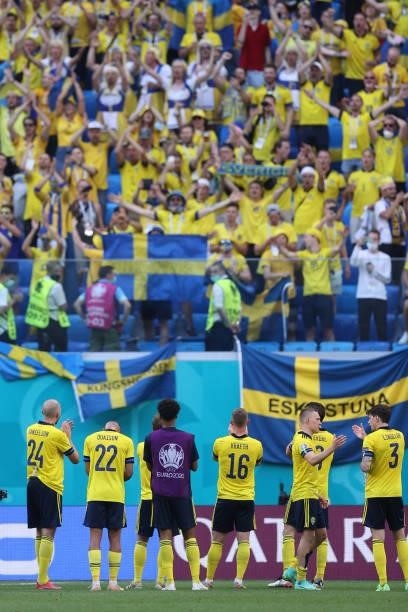 Sweden's players celebrate with fans at the end of the UEFA EURO 2020 Group E football match between Sweden and Slovakia at Saint Petersburg Stadium...