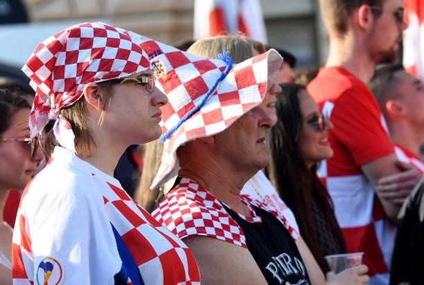 Supporters watch a broadcast of the UEFA EURO 2020 football match between Croatia and Czech Republic at the Jelacic square in Zagreb, on June 18,...