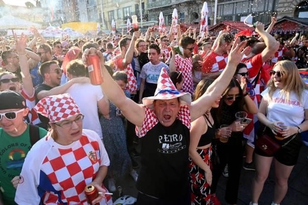 Supporters celebrate as they watch a broadcast of the UEFA EURO 2020 football match between Croatia and Czech Republic at the Jelacic square in...