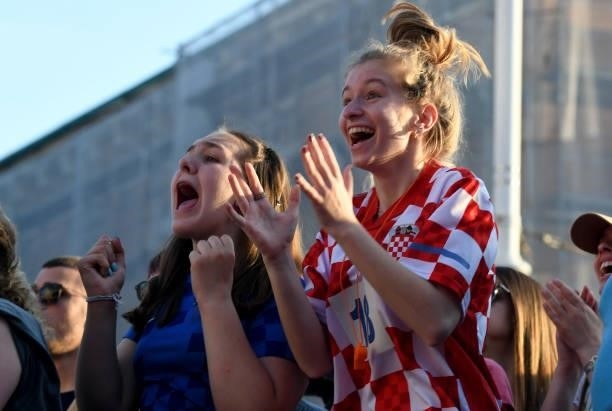 Supporters react as they watch a broadcast of the UEFA EURO 2020 football match between Croatia and Czech Republic at the Jelacic square in Zagreb,...