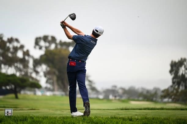Amateur Cole Hammer follows through as he plays his shot from the seventh tee during the first round of the 121st U.S. Open on the South Course at...