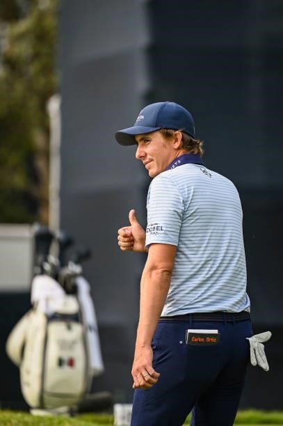 Carlos Ortiz of Mexico smiles and gives a thumbs up as he walks to the seventh tee during the first round of the 121st U.S. Open on the South Course...