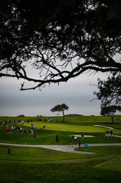 Scenic view of the fifth hole green as a marine layer of clouds and fog obscures the sun over the Pacific Ocean during the first round of the 121st...